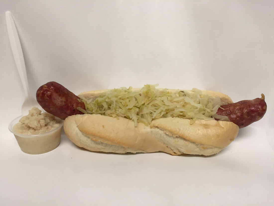 Raddell's Smoked Slovenian Sausage served on a bun with sauerkraut